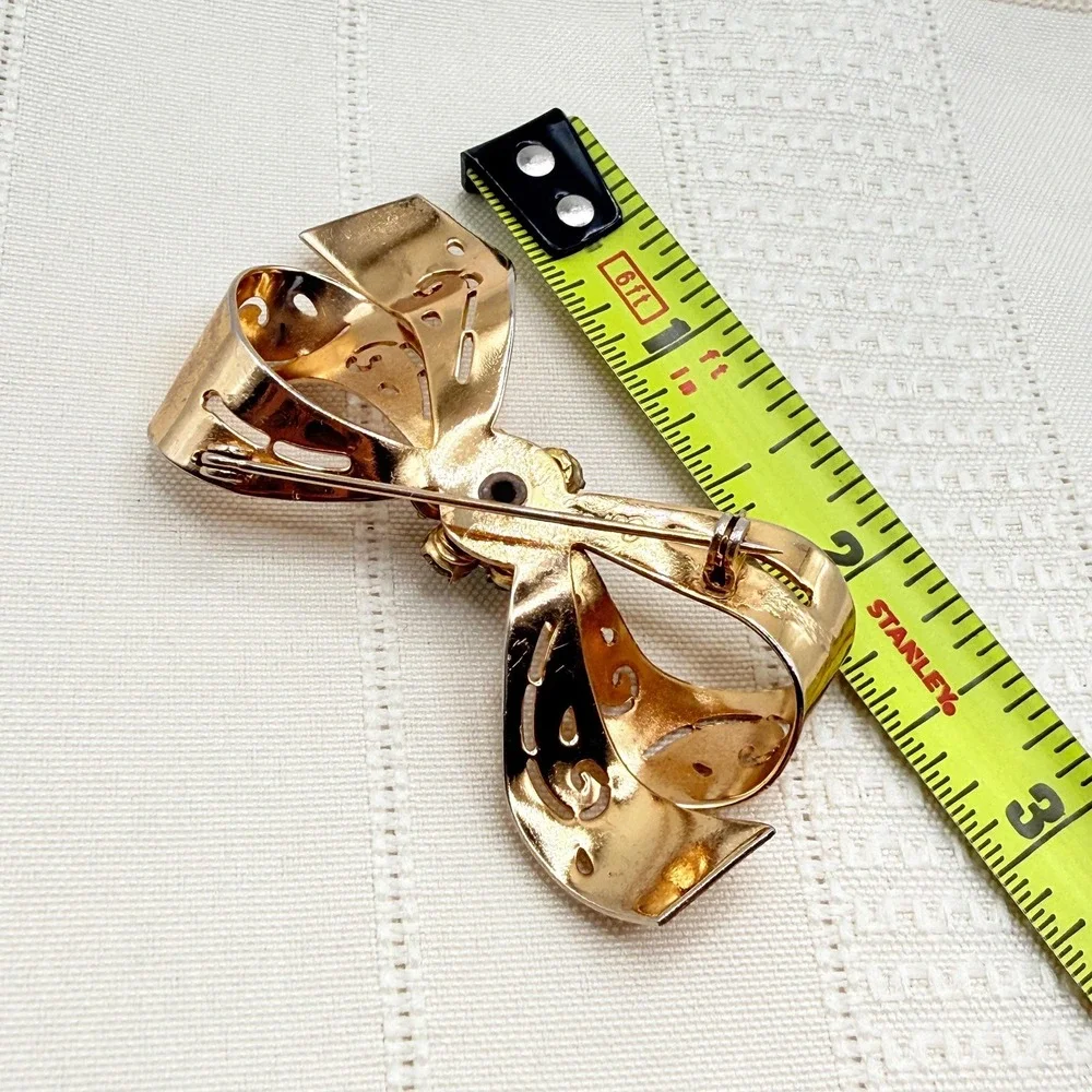 Vintage CORO Gray and Blue Rhinestones Gold Tone Cutout Bow Pin Brooch
